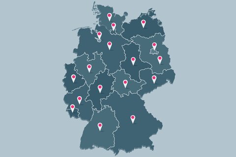 Eine Deutschlandkarte mit siebzehn Pins für die Kassenärztlichen Vereinigungen. 
