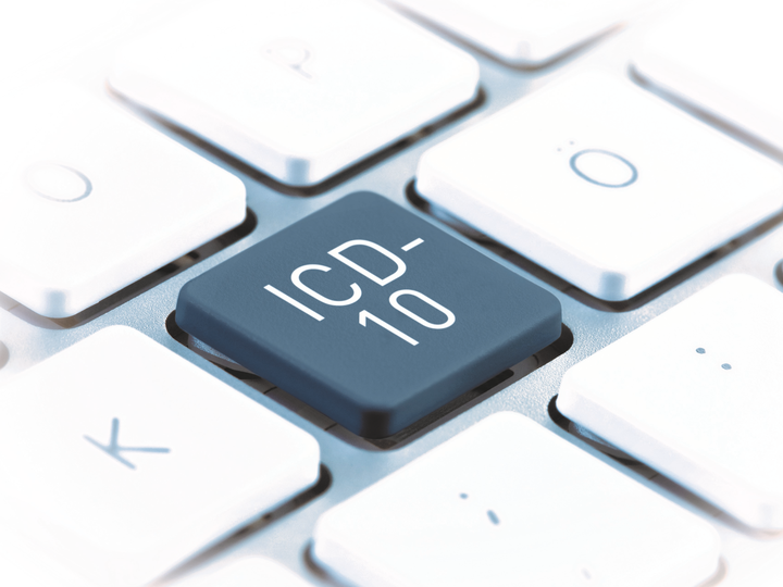 Ausschnitt einer Computertastatur mit einer grauen Taste auf der ICD-10 steht