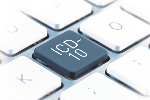 Ausschnitt einer Computertastatur mit einer grauen Taste auf der ICD-10 steht